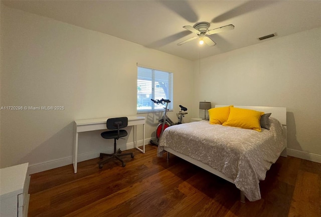 bedroom featuring ceiling fan and dark wood-type flooring