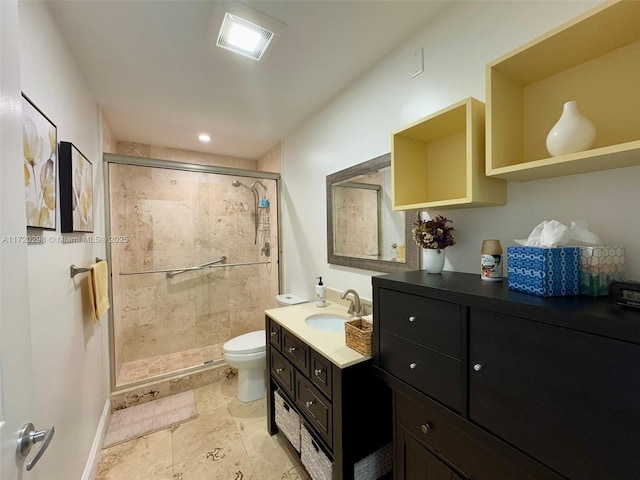 bathroom with walk in shower, vanity, and toilet