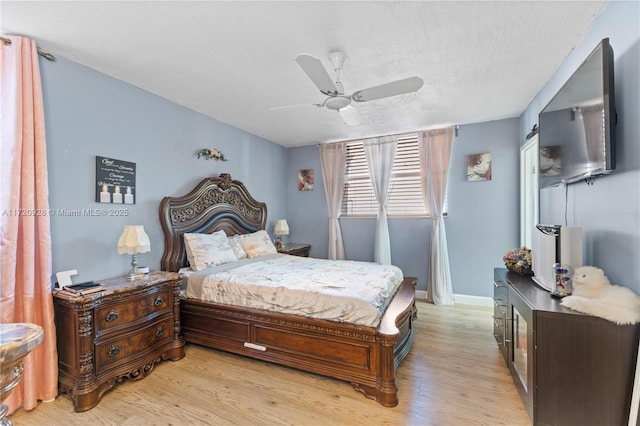 bedroom featuring ceiling fan and light hardwood / wood-style floors