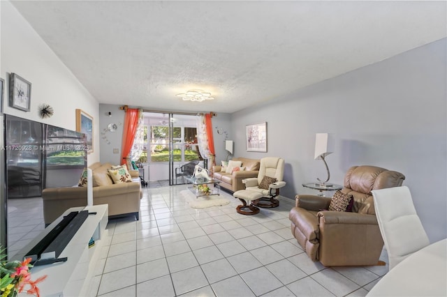 living room featuring light tile patterned floors and a textured ceiling