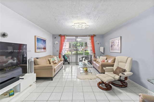 living room with light tile patterned floors and a textured ceiling