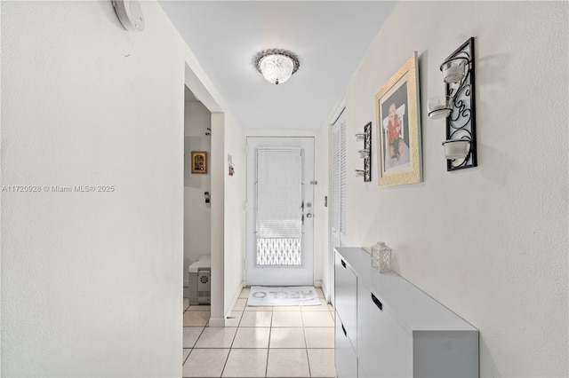 doorway featuring light tile patterned floors