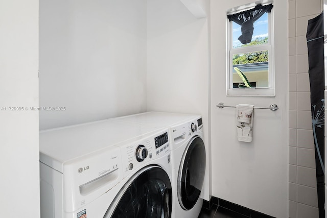 washroom with washing machine and dryer