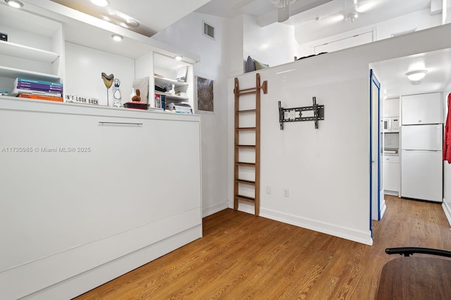 interior space with hardwood / wood-style flooring