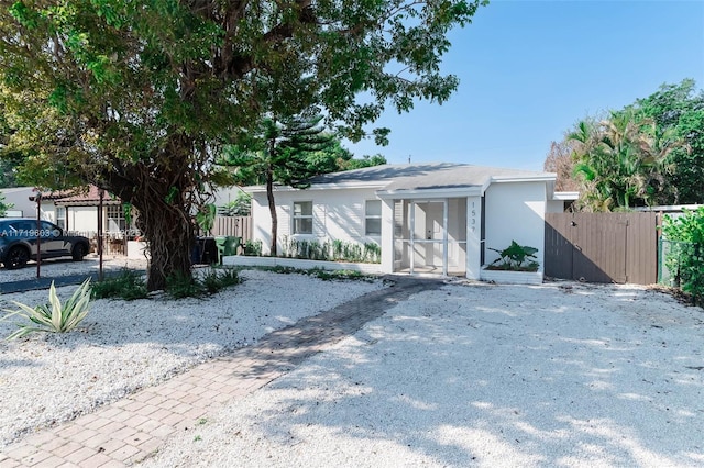 view of front of home featuring fence