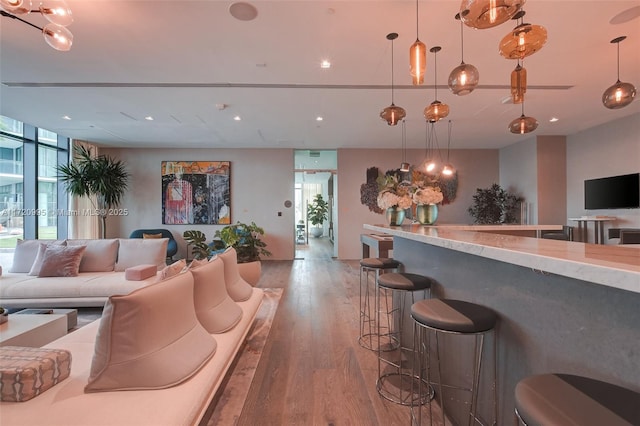 interior space featuring floor to ceiling windows and light hardwood / wood-style flooring