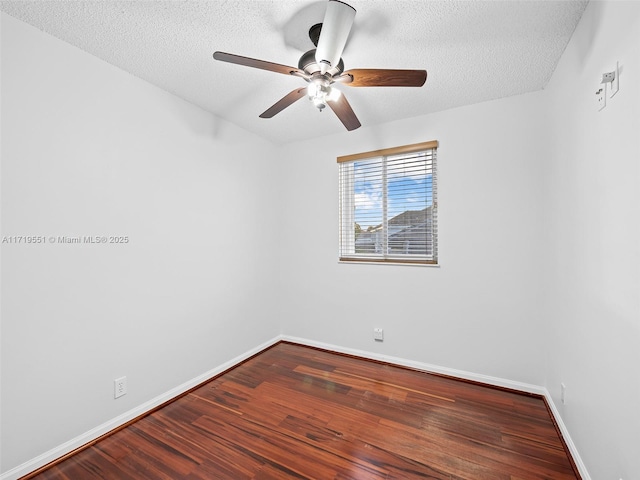 empty room with ceiling fan, a textured ceiling, and hardwood / wood-style flooring