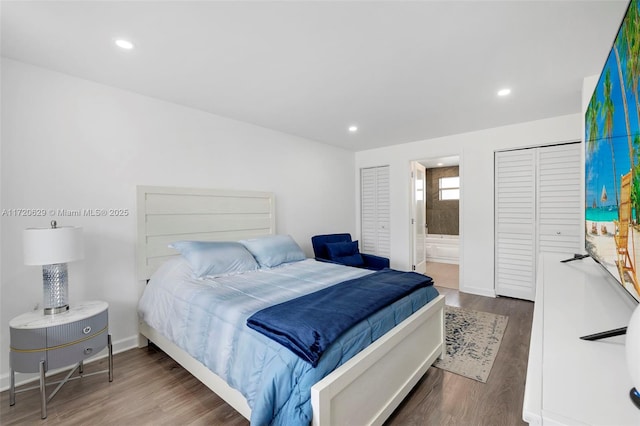 bedroom featuring hardwood / wood-style floors and ensuite bath