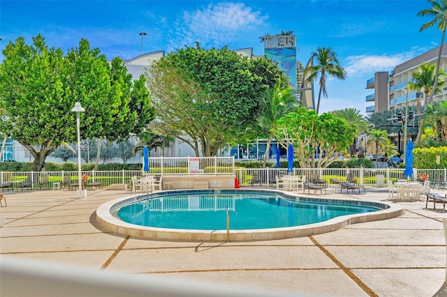 view of swimming pool featuring a patio area