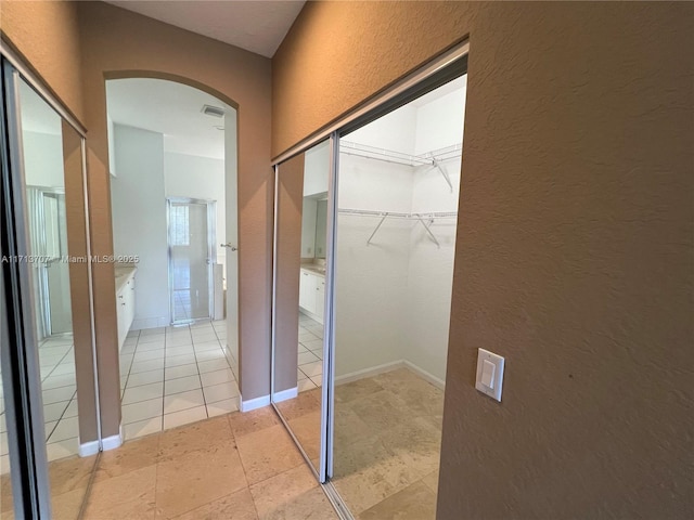 interior space featuring light tile patterned floors