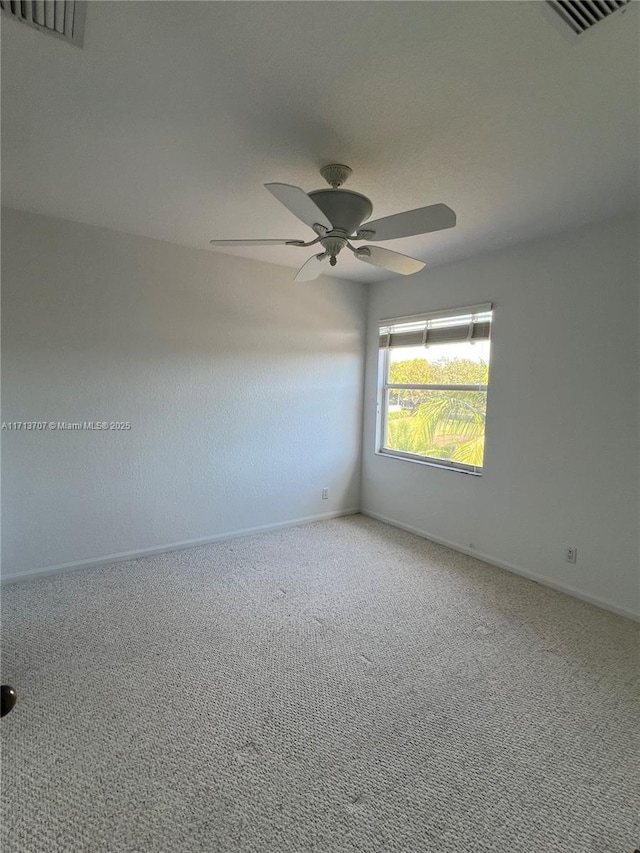 carpeted empty room with ceiling fan