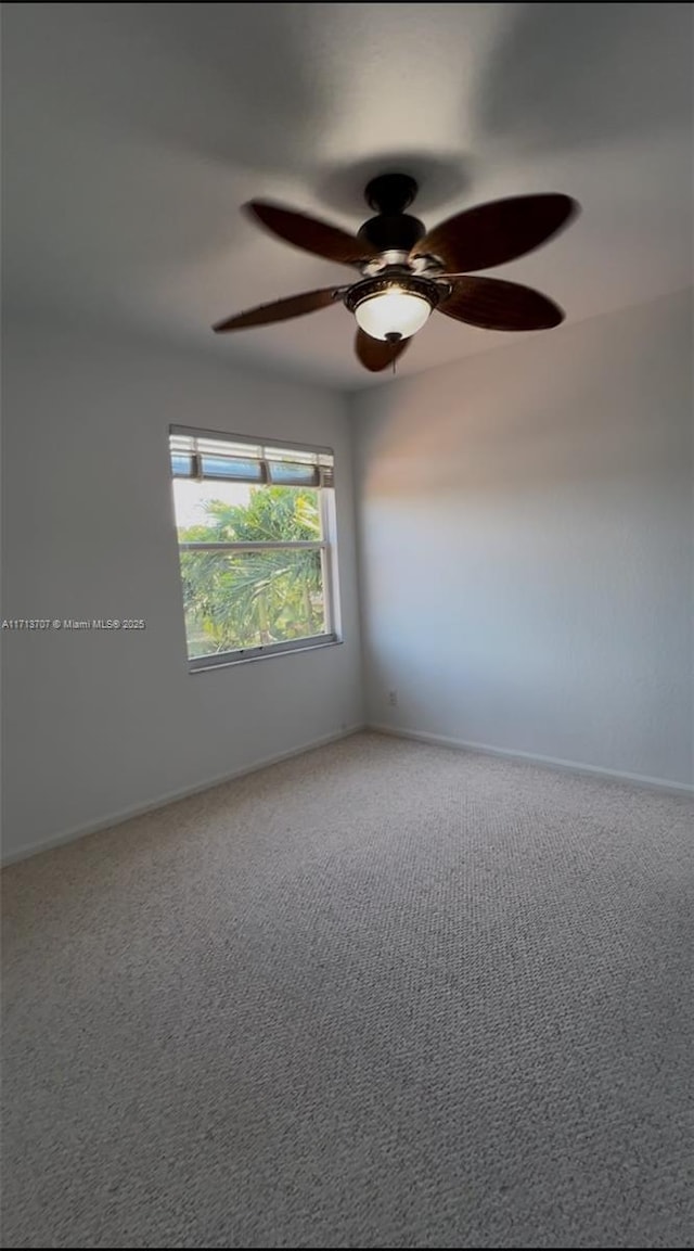 unfurnished room with carpet flooring and ceiling fan