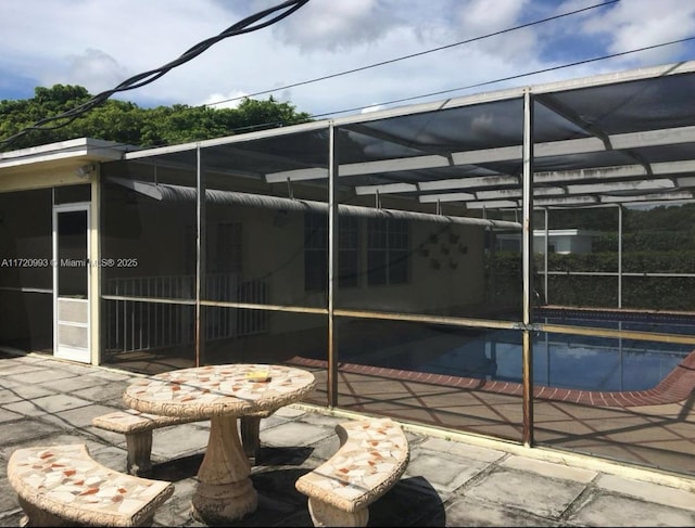 exterior space with a lanai and a patio area