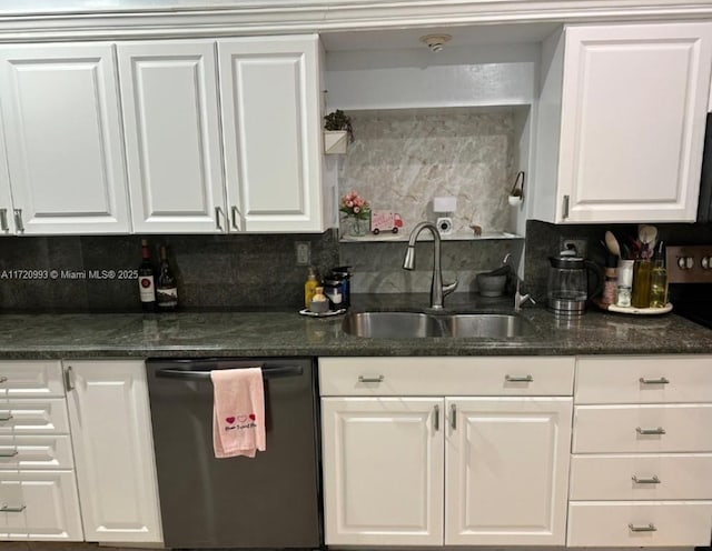 kitchen featuring dishwashing machine, white cabinetry, a sink, and backsplash
