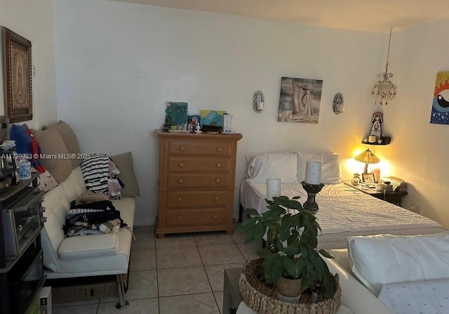 bedroom featuring light tile patterned floors