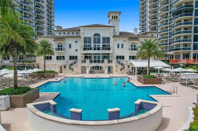 view of swimming pool with a patio area