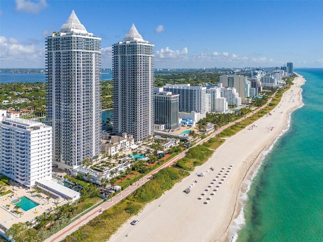 birds eye view of property featuring a view of the beach and a water view