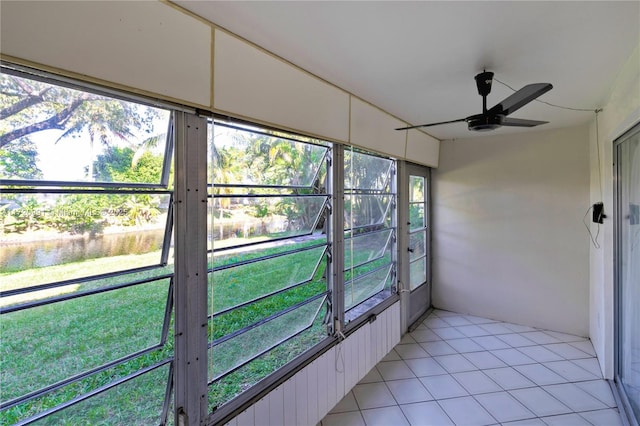 unfurnished sunroom with ceiling fan