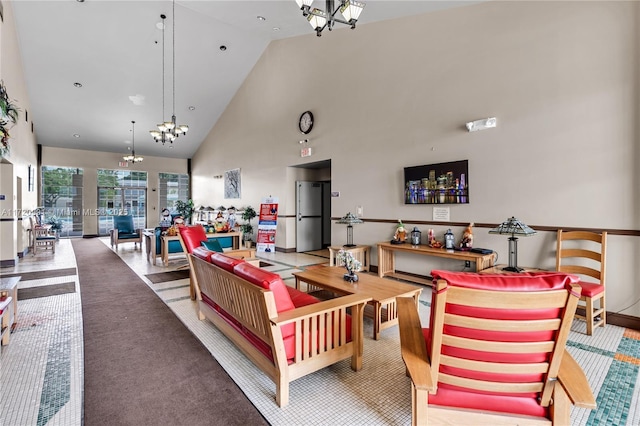 living room featuring high vaulted ceiling and a chandelier