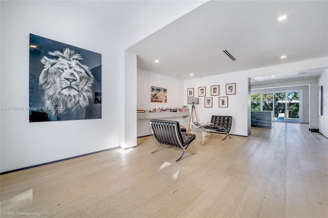 corridor featuring light hardwood / wood-style floors