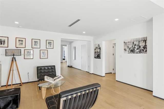 sitting room featuring light hardwood / wood-style floors