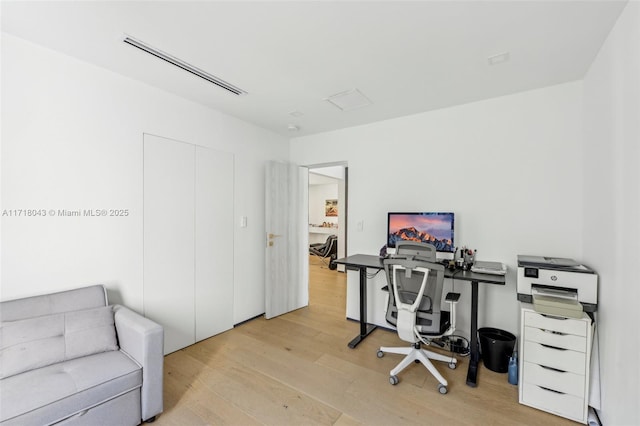 bedroom with light hardwood / wood-style floors