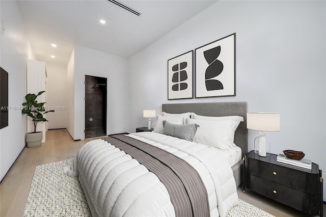 spacious closet with light hardwood / wood-style floors