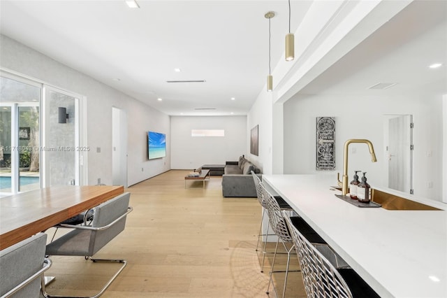 living room with light hardwood / wood-style floors