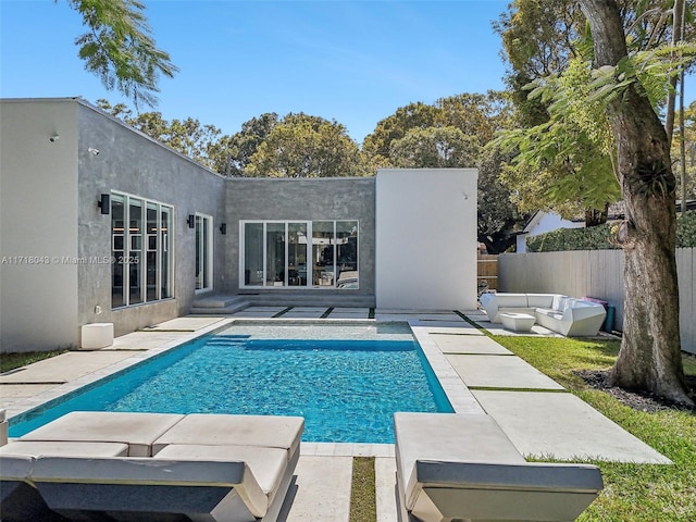 view of swimming pool with a patio