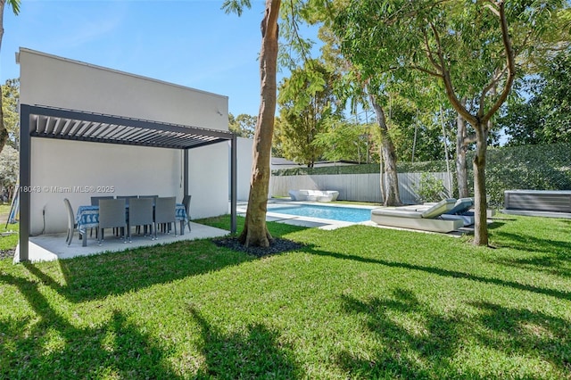 view of yard featuring a patio, a pergola, and a fenced in pool