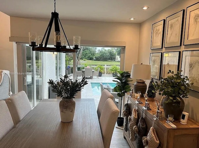 dining room with an inviting chandelier and a wealth of natural light