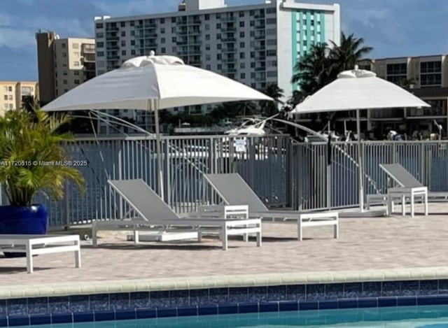 exterior space featuring a patio area and a community pool