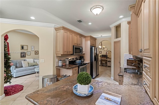 kitchen with crown molding, sink, light tile patterned floors, light brown cabinetry, and appliances with stainless steel finishes