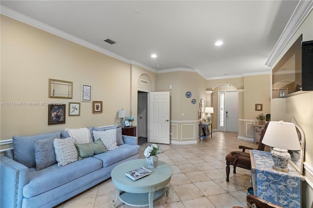 living room with ornamental molding and light tile patterned flooring