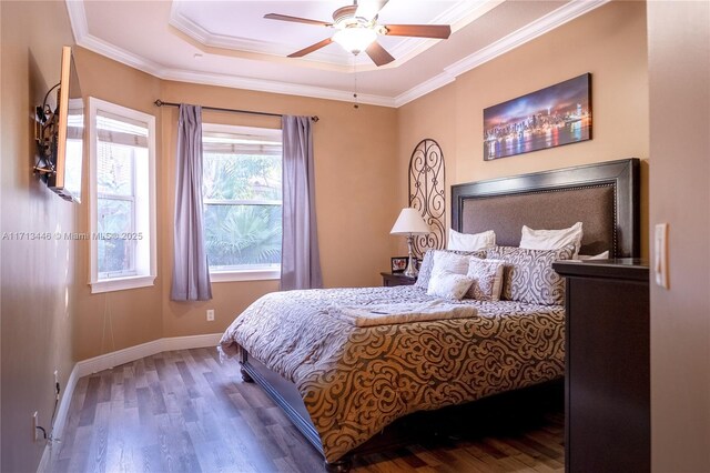 living room with light tile patterned floors, ceiling fan with notable chandelier, and ornamental molding