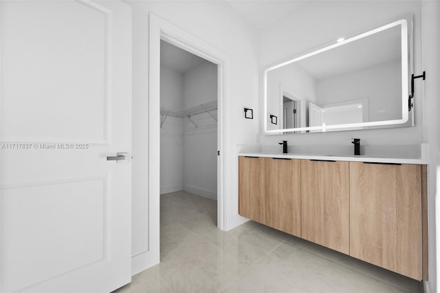 bathroom with tile patterned flooring and vanity