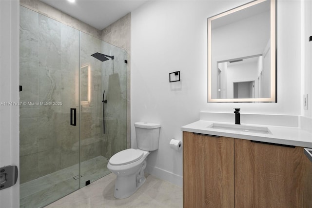 bathroom featuring tile patterned flooring, vanity, an enclosed shower, and toilet