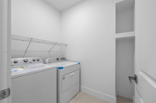 laundry area with washing machine and dryer