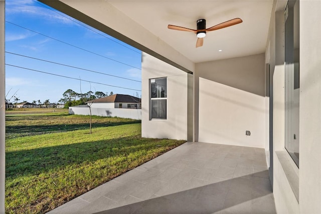 view of patio featuring ceiling fan