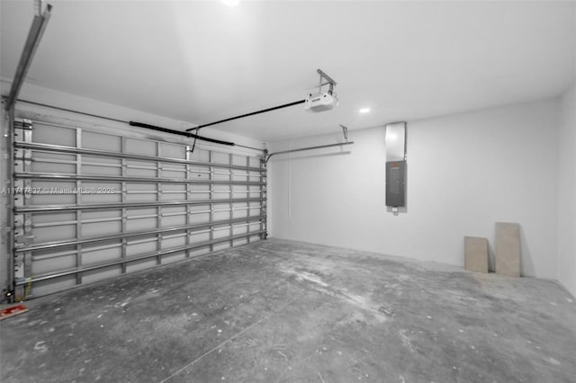 garage featuring a garage door opener and electric panel