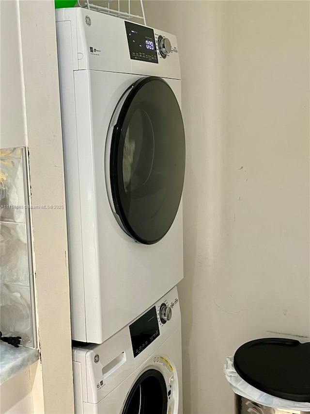 laundry area featuring stacked washer and clothes dryer