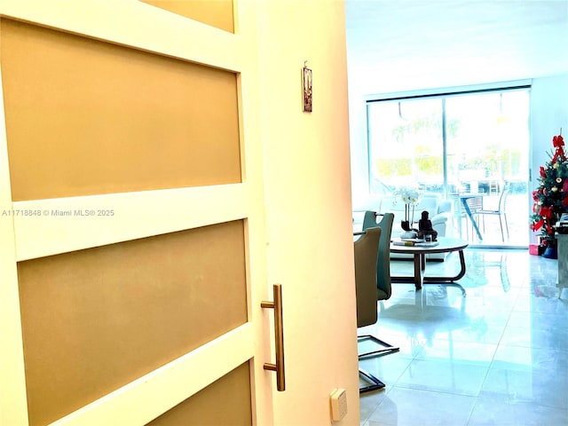 hallway featuring light tile patterned floors