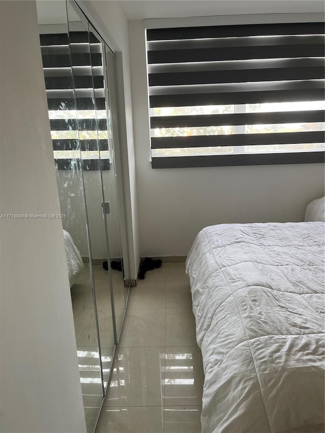 unfurnished bedroom featuring tile patterned floors