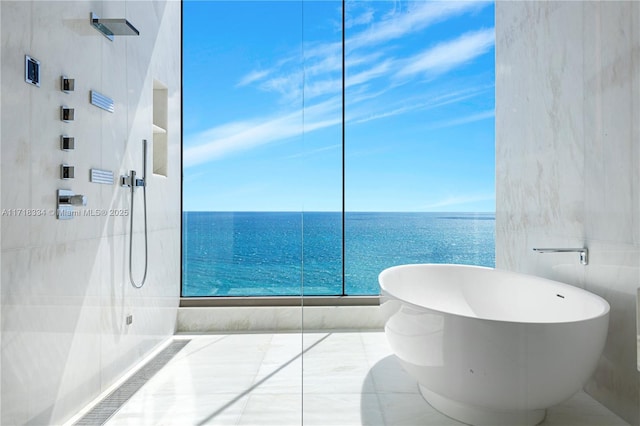 bathroom with plus walk in shower and a water view