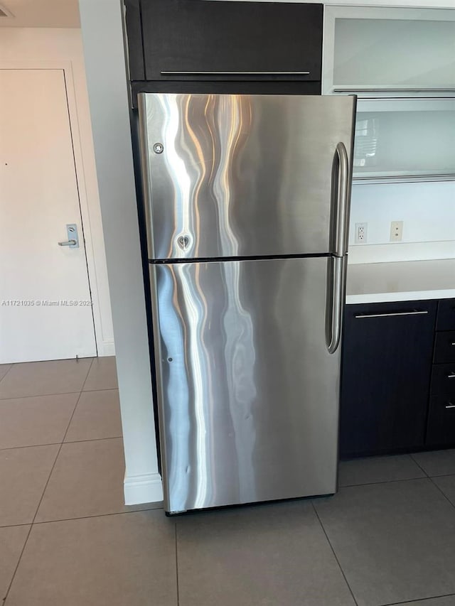 kitchen featuring stainless steel fridge and light tile patterned flooring