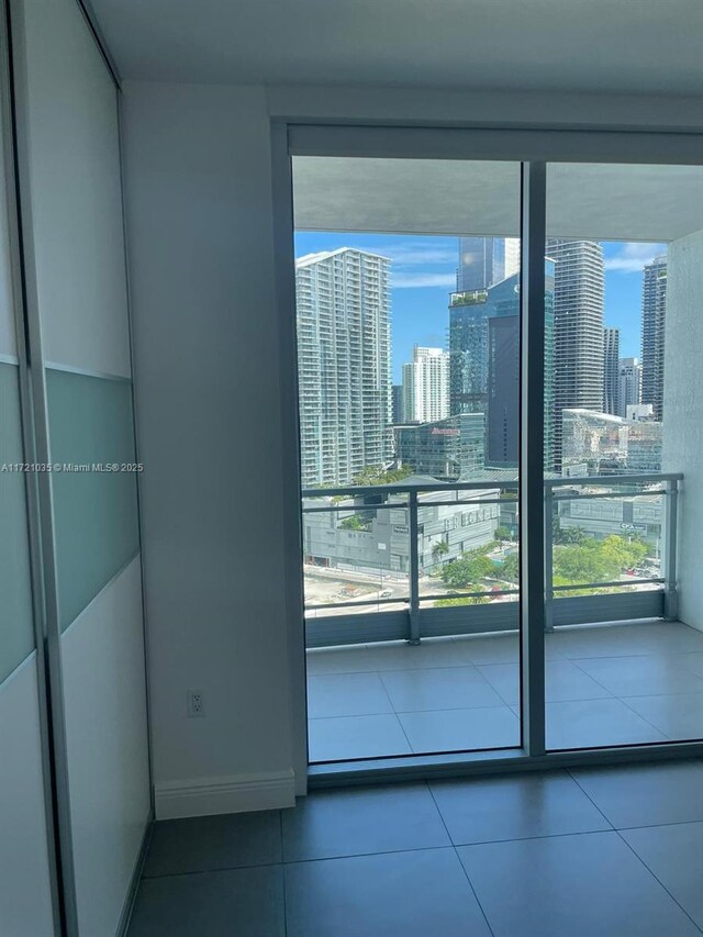 unfurnished room featuring tile patterned floors