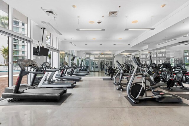 90 SW 3rd St Unit 2603, Miami, FL 33130 - kitchen with freestanding refrigerator, a sink, dark cabinetry, light tile patterned floors, and light countertops