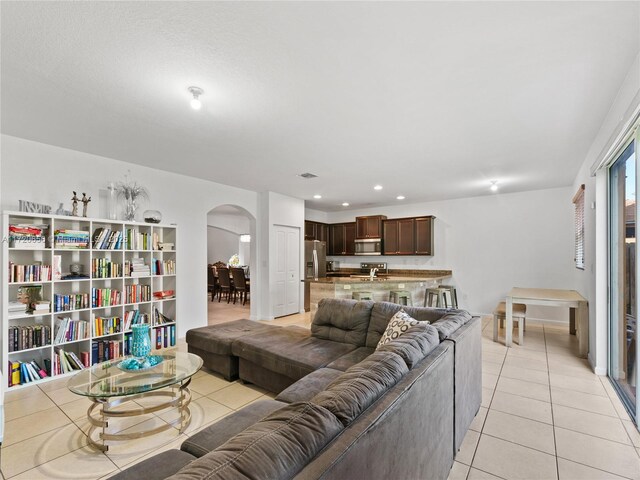 living room with light tile patterned flooring