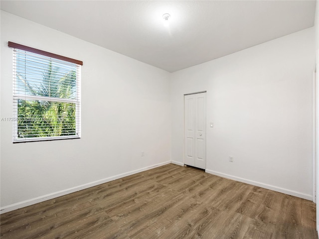 empty room featuring hardwood / wood-style flooring