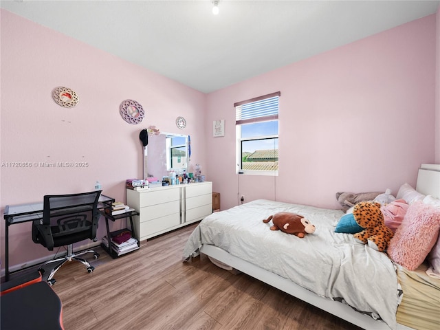 bedroom with light hardwood / wood-style flooring